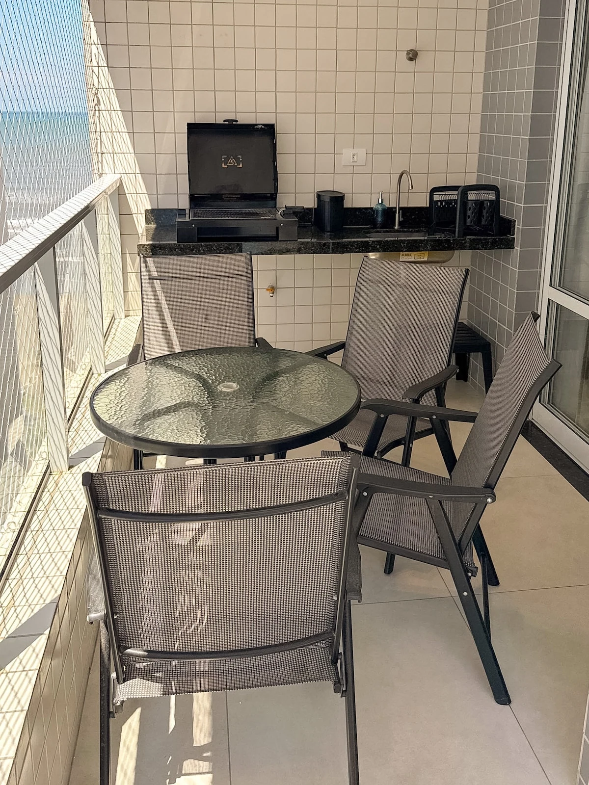 Balcony chairs, beachfront apartment in Praia Grande